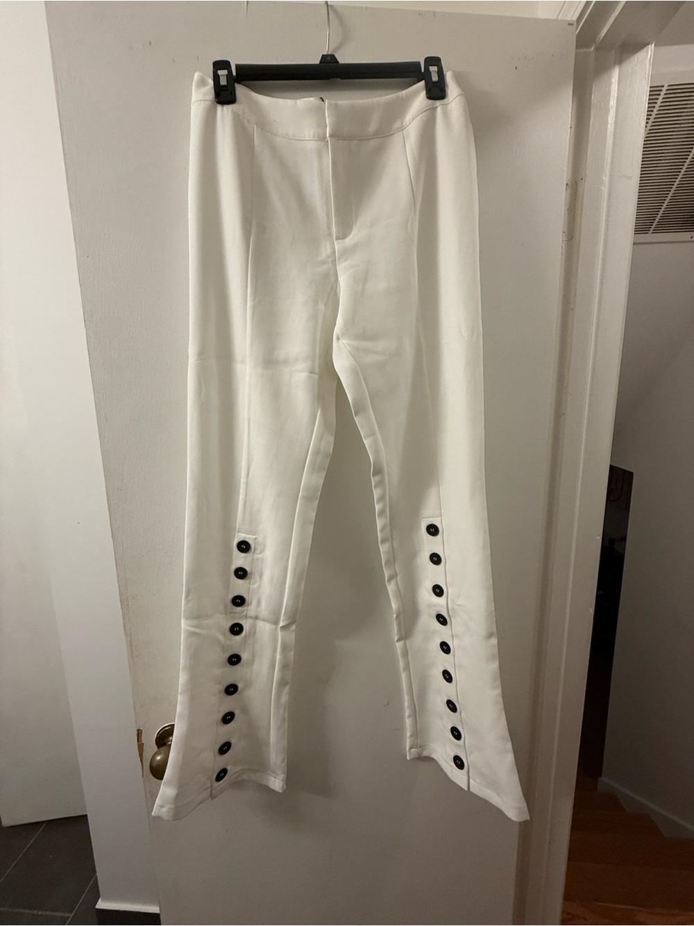 Fashion Nova White Flare Pants with Black Button Trim